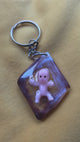 Cute or Creepy Baby Keychain – Cosmic Drift